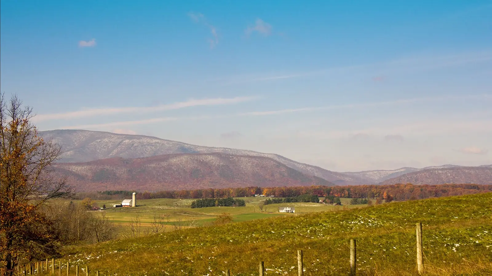 Fenced pasture in the Shenandoah Valley of Virginia with the Blue Ridge behind
