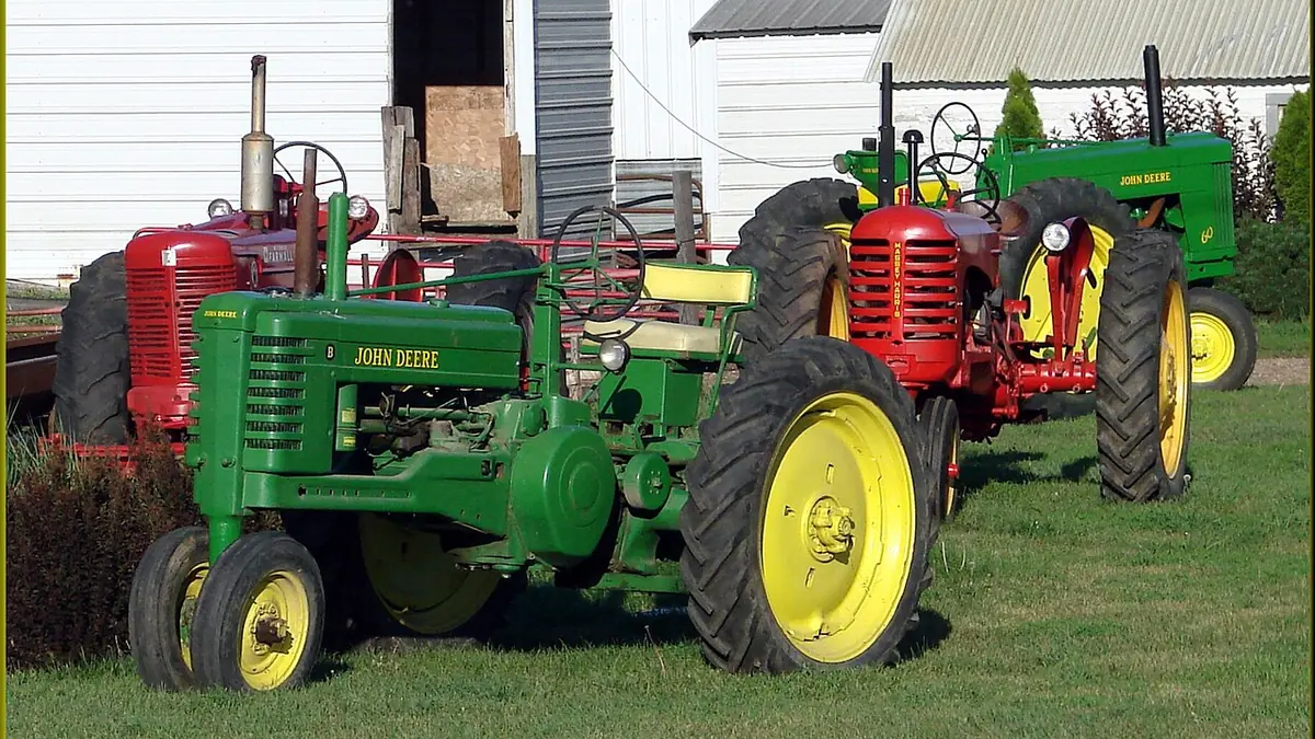 A row of vintage tractors at an old machinery yard in northwest Iowa